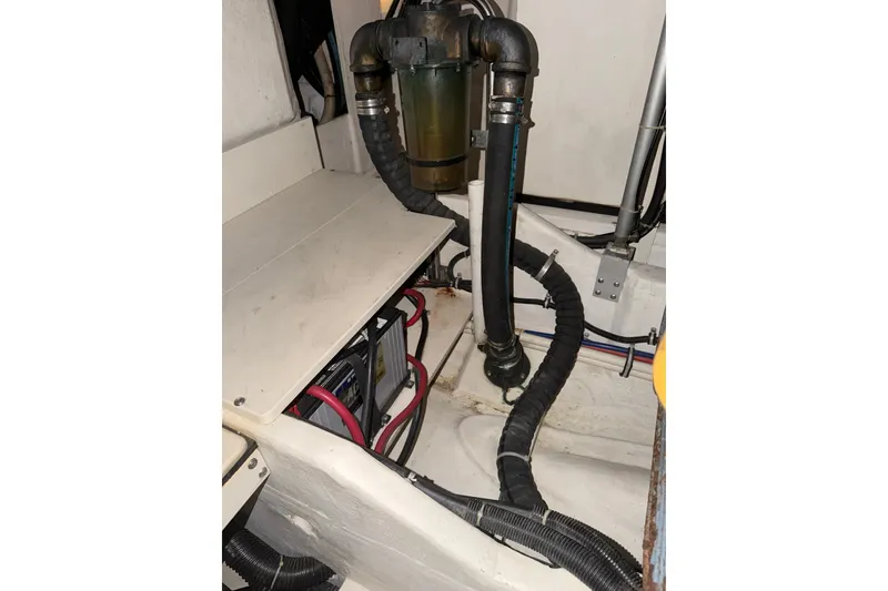 Slide: The Image of Engine compartment of a 1998 Tiara Yachts 4000 Express, showing hoses and wiring. - 33