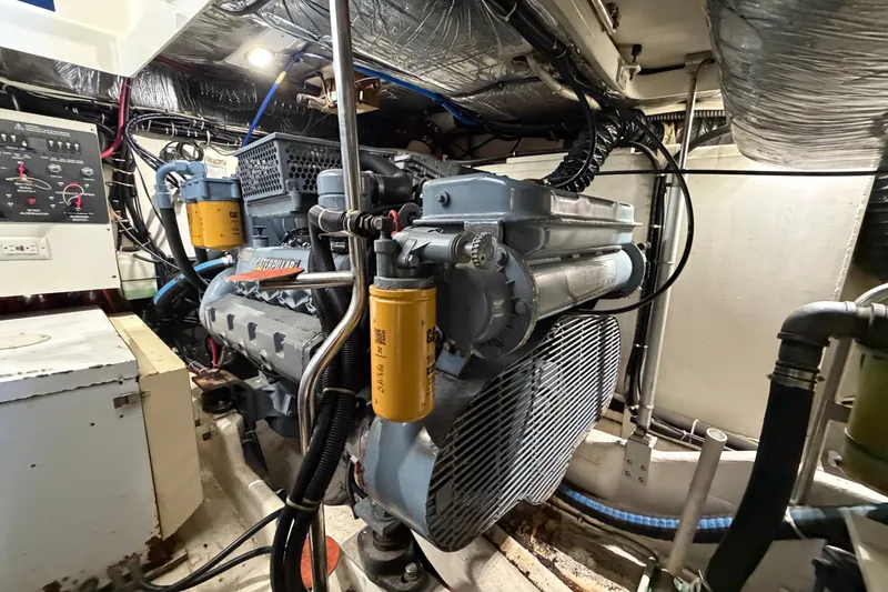 Slide: The Image of Engine room of a 1998 Tiara Yachts 4000 Express, featuring a Caterpillar engine. - 26