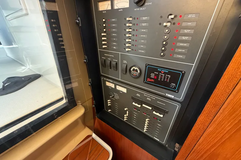 Slide: The Image of Electrical control panel on a 1998 Tiara Yachts 4000 Express boat. - 19