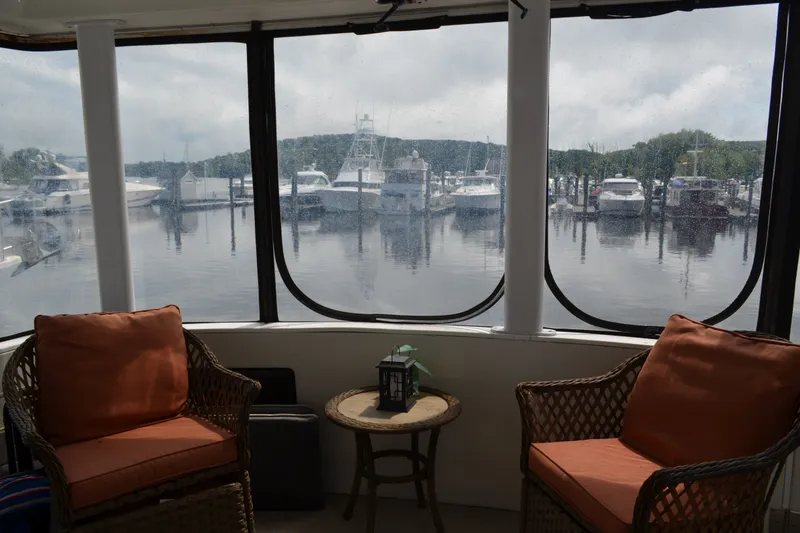 Slide: The Image of Interior view from 1996 Carver 440 Aft Cabin Motor Yacht overlooking marina. - 14