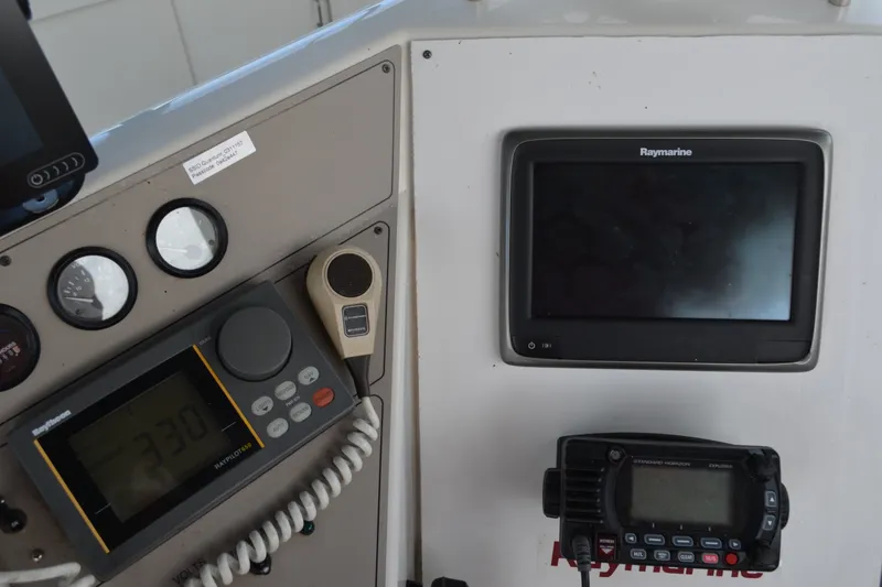 Slide: The Image of Control panel of a 1996 Carver 440 Aft Cabin Motor Yacht with navigation equipment. - 26