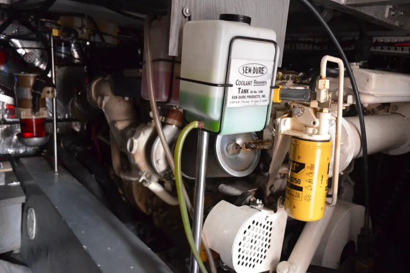 Slide: The Image of Engine room of 1996 Carver 440 Aft Cabin Motor Yacht with coolant recovery tank. - 68