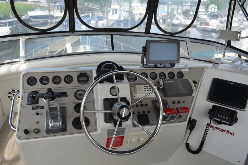 Slide: The Image of Helm of 1996 Carver 440 Aft Cabin Motor Yacht with navigation equipment and controls. - 18