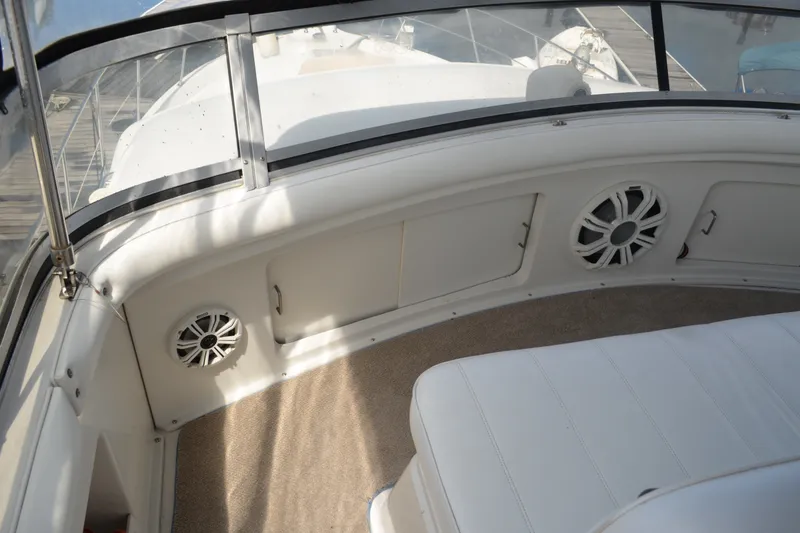 Slide: The Image of 1996 Carver 440 Aft Cabin Motor Yacht interior with speakers and seating. - 23