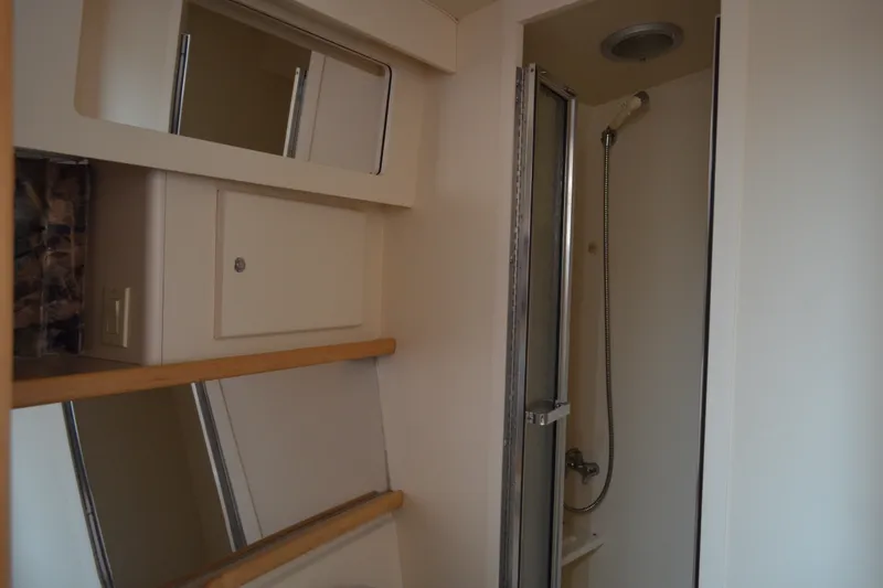 Slide: The Image of Bathroom interior of 1996 Carver 440 Aft Cabin Motor Yacht with shower and mirrors. - 54