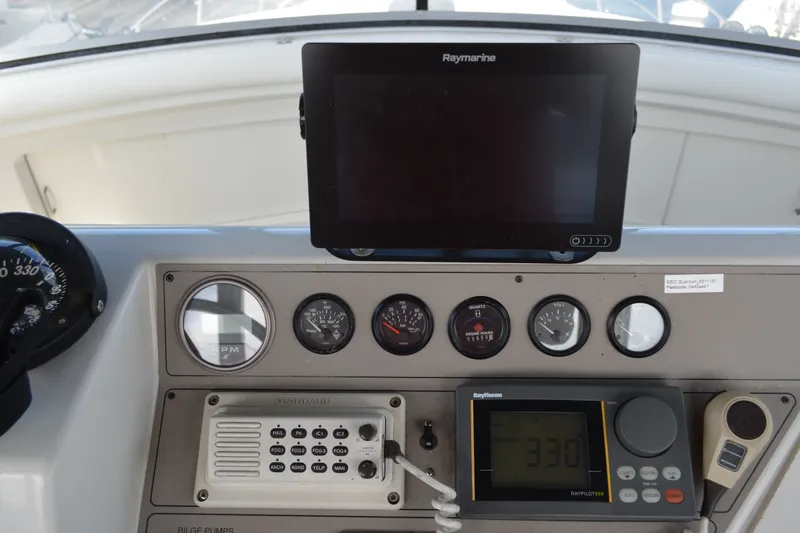 Slide: The Image of Control panel of a 1996 Carver 440 Aft Cabin Motor Yacht with navigation instruments. - 25