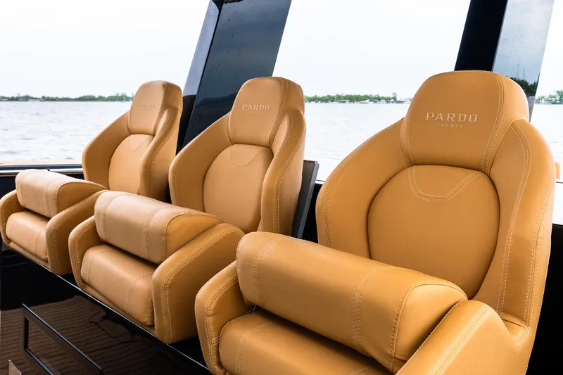Slide: The Image of Luxurious tan leather seats on 2025 Pardo Yachts 43, overlooking serene waters. - 24