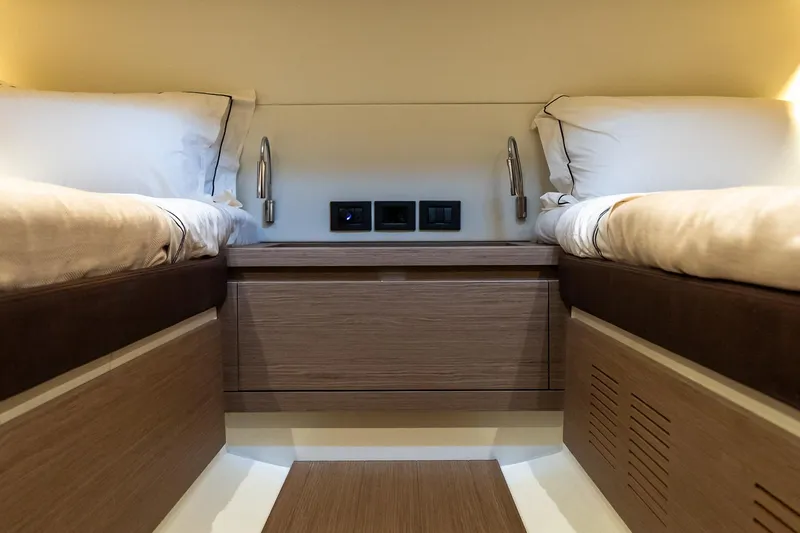 Slide: The Image of Luxurious cabin interior of 2025 Pardo Yachts 43, featuring twin beds and modern lighting. - 49