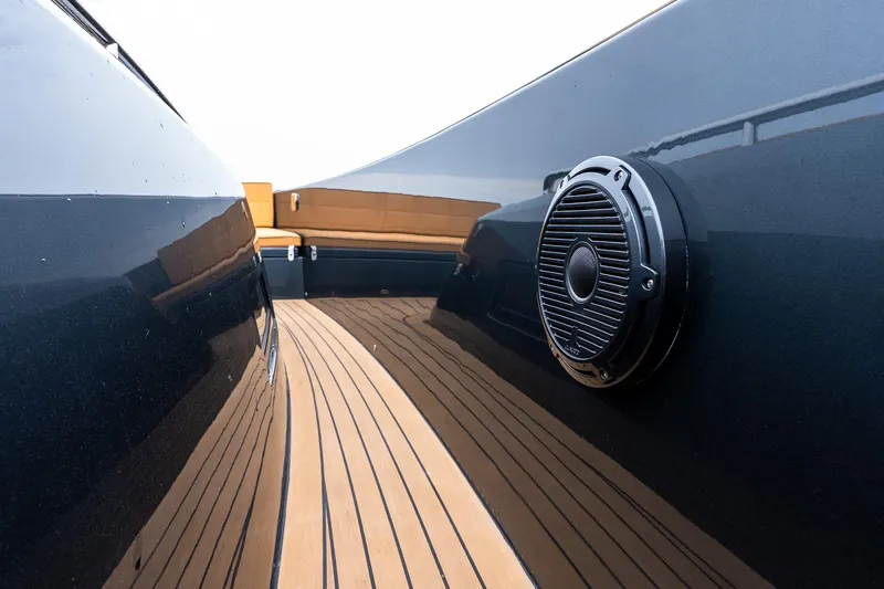Slide: The Image of Sleek 2025 Pardo Yachts 43 deck with speaker and elegant wood finish. - 35