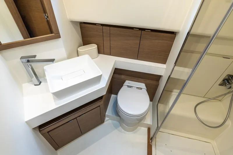 Slide: The Image of Luxurious bathroom in 2025 Pardo Yachts 43, featuring modern fixtures and elegant wood cabinetry. - 52