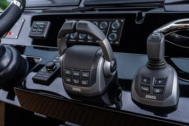 Slide: The Image of Control panel of 2025 Pardo Yachts 43 featuring Volvo Penta throttle and joystick. - 33