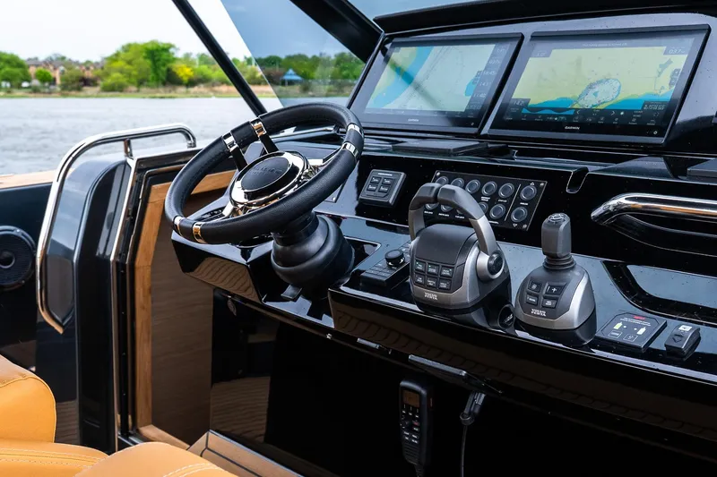 Slide: The Image of Helm of 2025 Pardo Yachts 43 with advanced navigation displays and controls. - 27