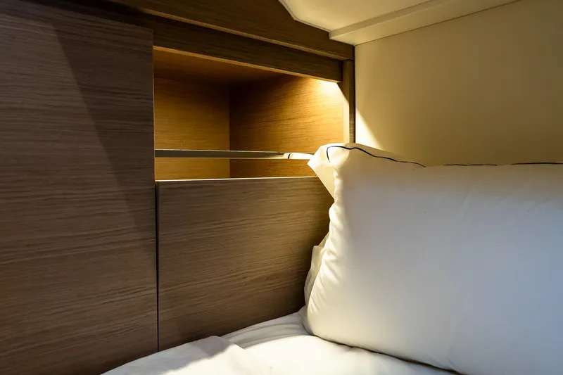 Slide: The Image of Luxurious cabin interior of 2025 Pardo Yachts 43, featuring elegant wood finish and soft lighting. - 51