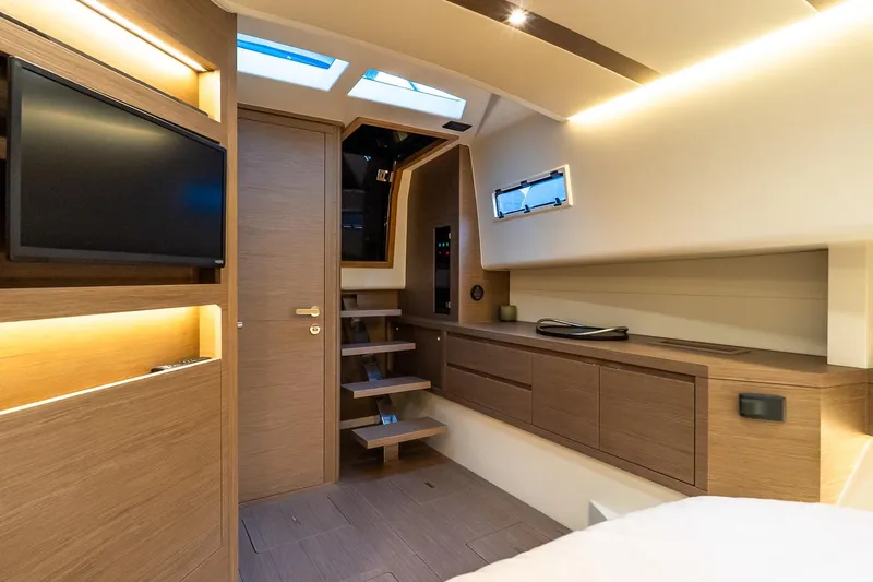 Slide: The Image of Luxurious interior of 2025 Pardo Yachts 43, featuring modern wood finishes and ambient lighting. - 46
