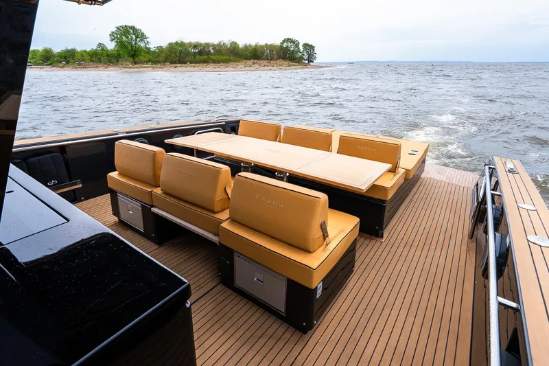 Slide: The Image of Luxurious 2025 Pardo Yachts 43 with elegant seating on open deck, cruising on serene waters. - 14