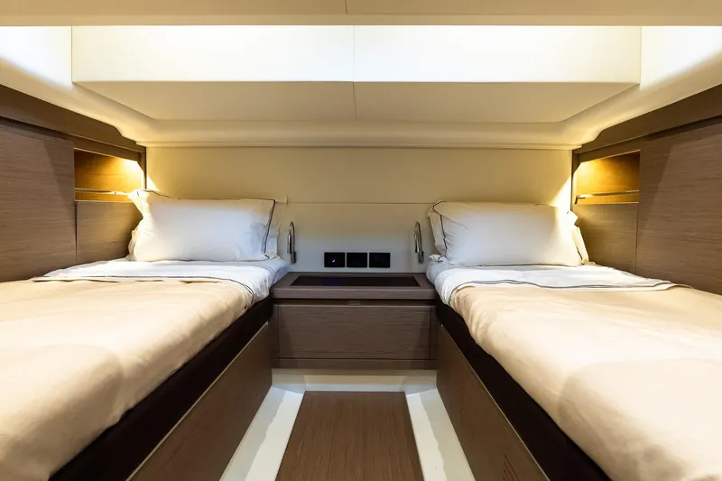 Slide: The Image of Luxurious twin cabin interior of 2025 Pardo Yachts 43, featuring elegant wood finishes. - 50
