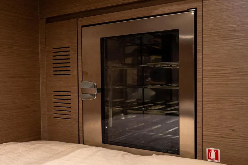 Slide: The Image of Interior of 2025 Pardo Yachts 43, featuring a sleek stainless steel cabinet. - 43