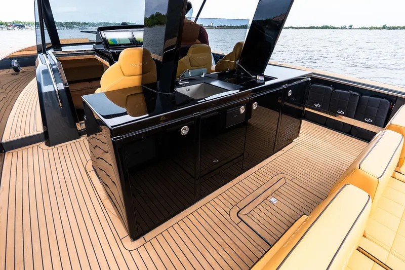 Slide: The Image of Luxurious 2025 Pardo Yachts 43 interior with sleek black cabinetry and tan seating. - 18