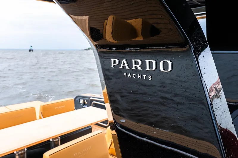Slide: The Image of Pardo Yachts 43, 2025 model, sleek design with luxurious seating on open water. - 22
