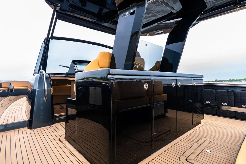 Slide: The Image of Luxurious 2025 Pardo Yachts 43 interior with sleek black cabinetry and elegant seating. - 17