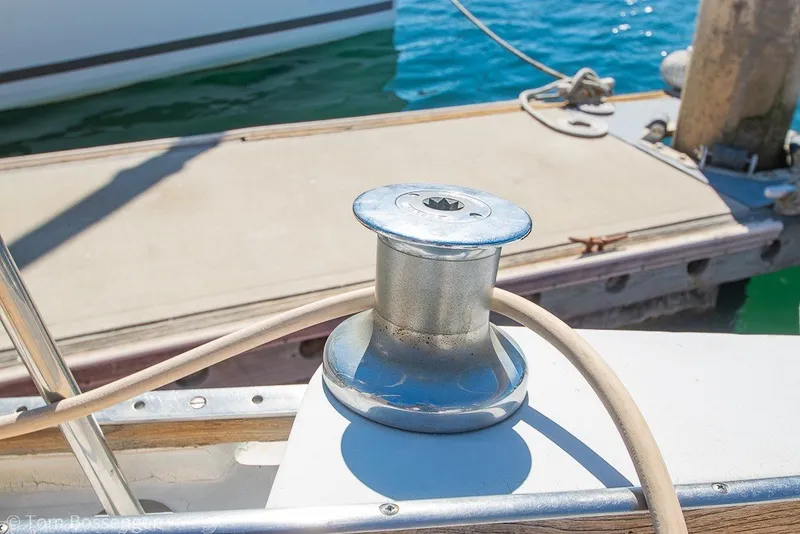 Slide: The Image of Winch on 1973 Challenger 32 sailboat deck by the water. - 29