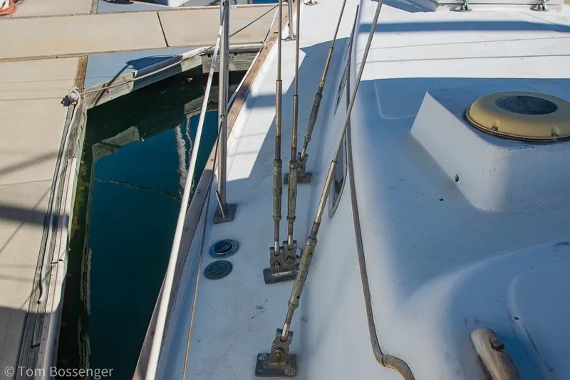 Slide: The Image of 1973 Challenger 32 sailboat deck with rigging and dockside view. - 31