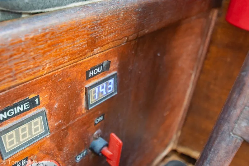 Slide: The Image of 1973 Challenger 32 engine control panel with hour meter reading 14.3. - 22