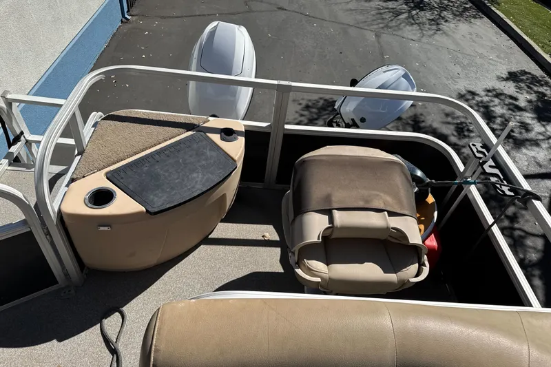 Slide: The Image of 2019 Sun Tracker Bass Buggy 18 DLX interior with seating and storage compartments. - 21