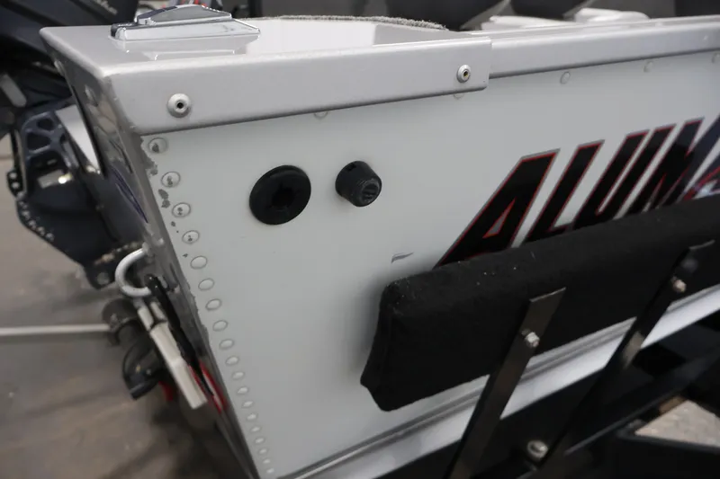Slide: The Image of 2015 Alumacraft Classic 165 Tiller boat detail, featuring riveted aluminum construction. - 36