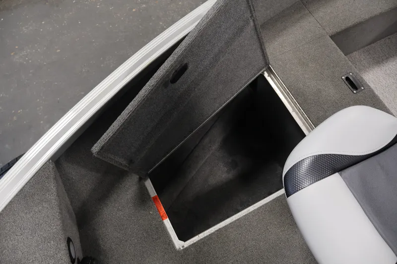 Slide: The Image of 2015 Alumacraft Classic 165 Tiller boat interior with open storage compartment. - 17