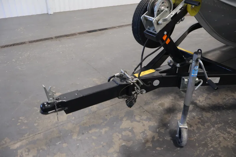 Slide: The Image of Trailer hitch of 2015 Alumacraft Classic 165 Tiller boat in a garage setting. - 31