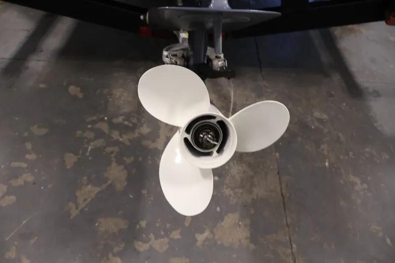 Slide: The Image of 2015 Alumacraft Classic 165 Tiller boat propeller on concrete floor. - 30