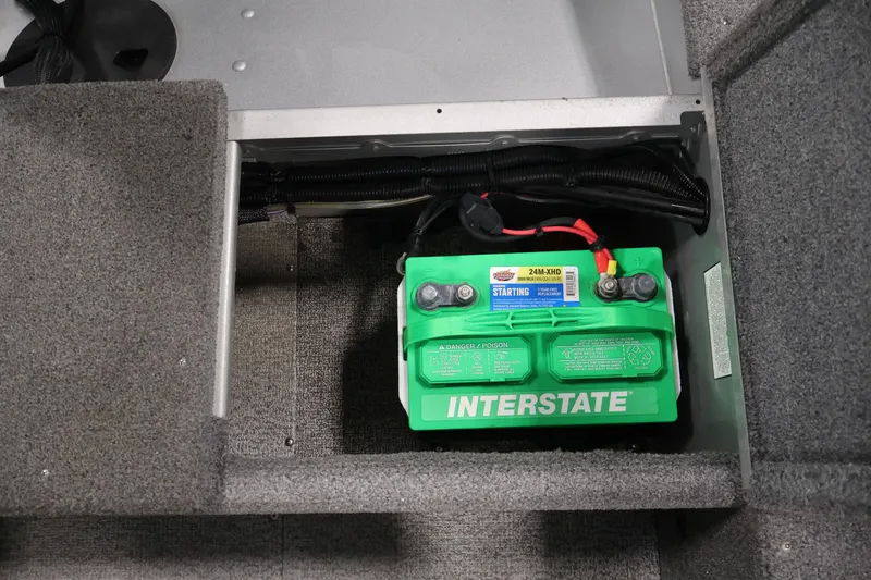 Slide: The Image of 2015 Alumacraft Classic 165 Tiller boat battery compartment with Interstate battery. - 25