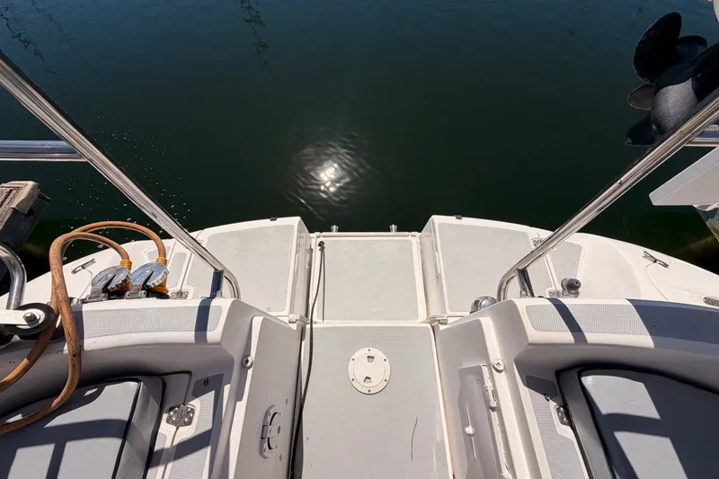 Slide: The Image of Rear deck of a 2002 Hunter 460 boat with water reflection. - 27