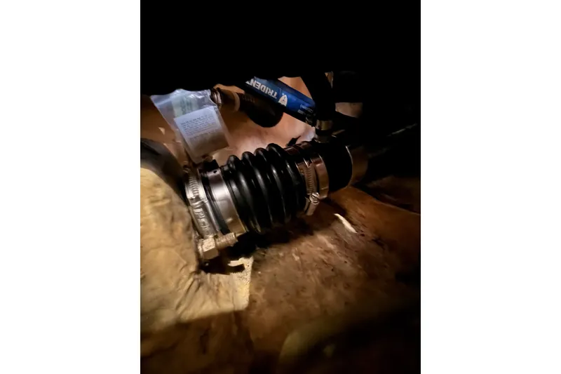 Slide: The Image of Close-up of a mechanical component in a 2002 Hunter 460 boat. - 81