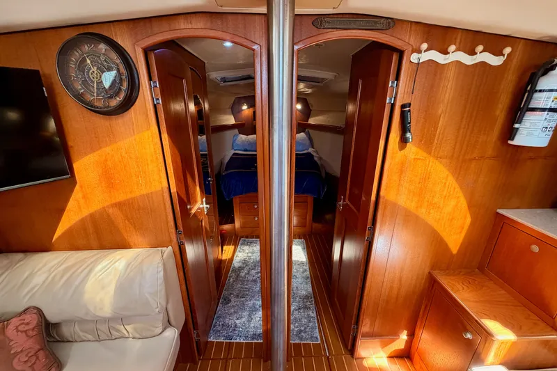 Slide: The Image of Interior of 2002 Hunter 460 yacht with wooden finish and cozy cabin. - 66
