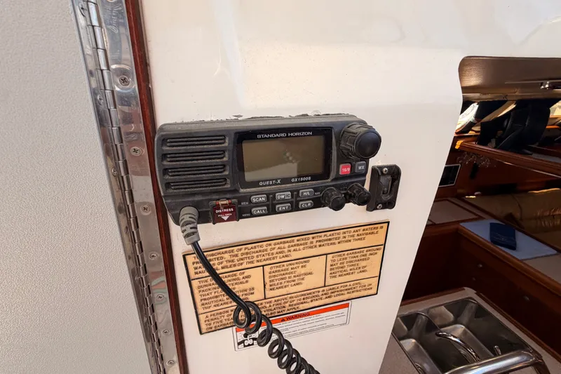 Slide: The Image of Standard Horizon marine radio on 2002 Hunter 460 sailboat, near cabin entrance. - 34