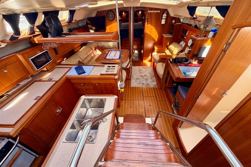 Slide: The Image of Luxurious interior of a 2002 Hunter 460 yacht with wood finishes and modern amenities. - 36