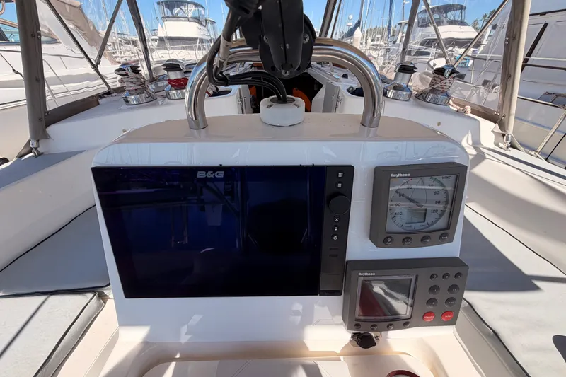 Slide: The Image of Cockpit of 2002 Hunter 460 sailboat with navigation instruments and controls. - 31