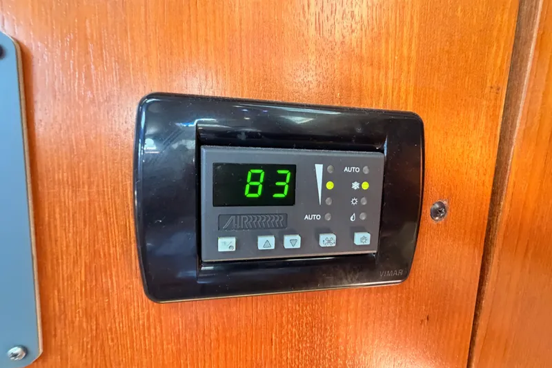 Slide: The Image of Digital thermostat on a 2002 Hunter 460 yacht, displaying temperature setting. - 63