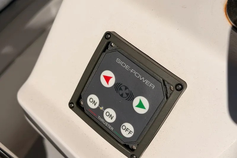 Slide: The Image of Control panel of a 2002 Hunter 460 boat with Side-Power thruster buttons. - 29