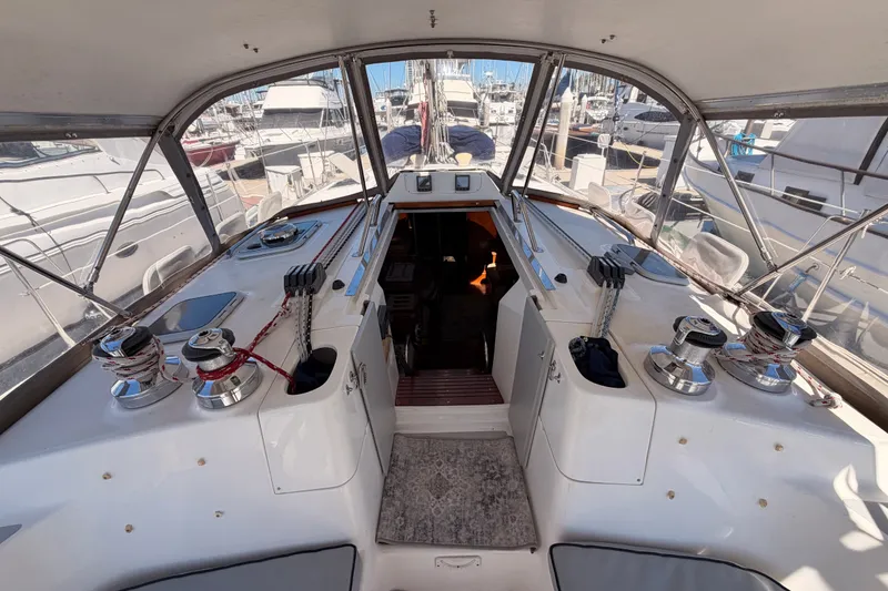 Slide: The Image of Interior view of a 2002 Hunter 460 sailboat cockpit with winches and ropes. - 33