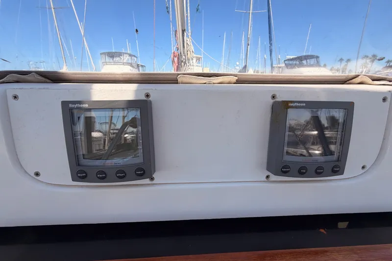 Slide: The Image of Dual Raytheon marine displays on a 2002 Hunter 460 sailboat dashboard. - 35