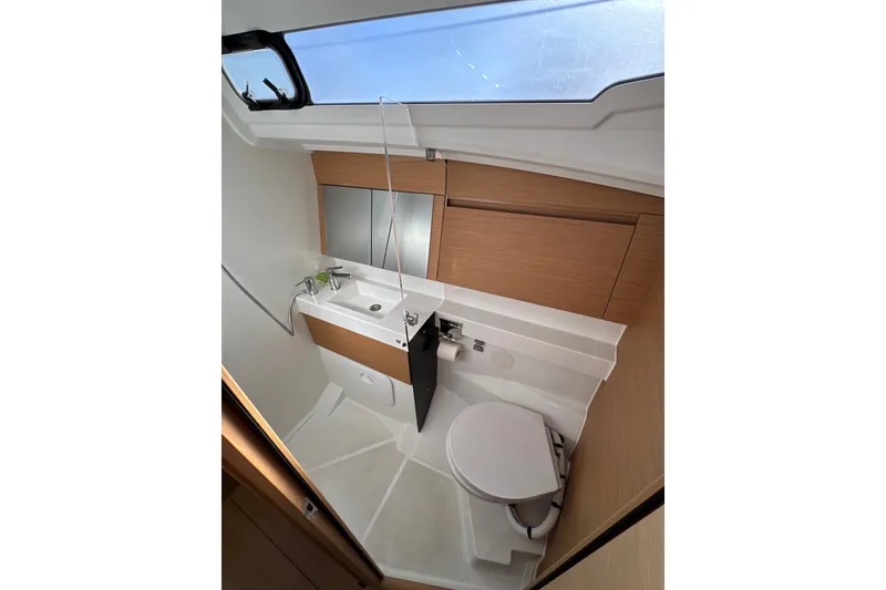 Slide: The Image of Modern bathroom interior of 2022 Jeanneau Sun Odyssey 410 yacht with skylight and sleek fixtures. - 17