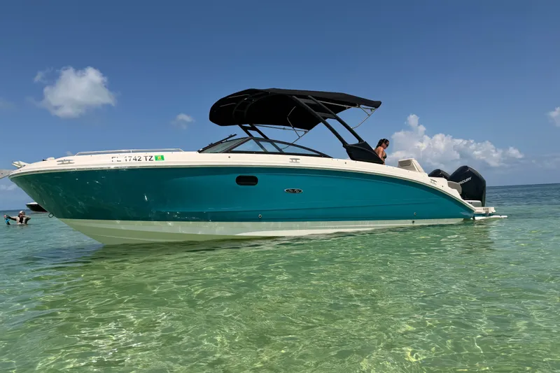 The Image of 2022 Sea Ray SDX 290 Outboard boat in clear turquoise water under a blue sky. - 1
