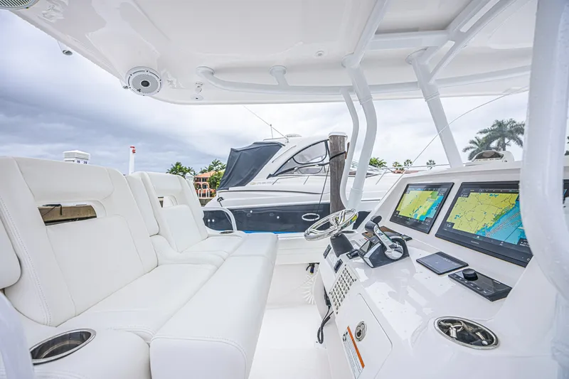 Slide: The Image of Interior view of 2023 Intrepid 327 Nomad boat with modern navigation system. - 8