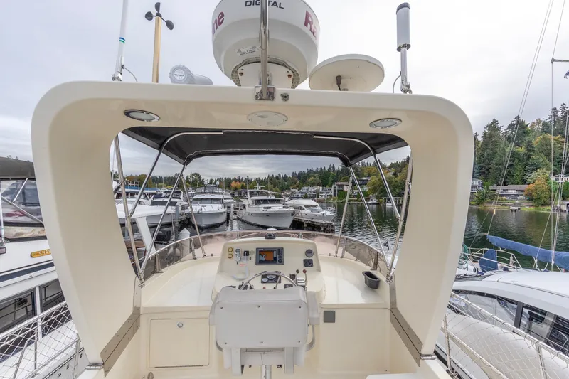 Slide: The Image of Pilothouse view of 2010 North Pacific 39 yacht docked in a marina. - 35