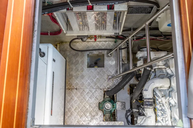 Slide: The Image of Engine room of 2010 North Pacific 39 Pilothouse with visible machinery and wiring. - 47