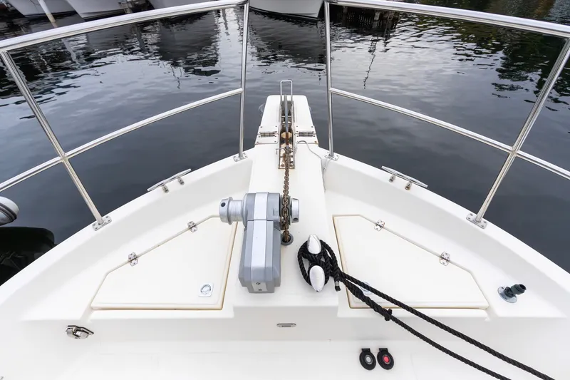 Slide: The Image of Bow view of 2010 North Pacific 39 Pilothouse yacht with anchor and railing. - 32
