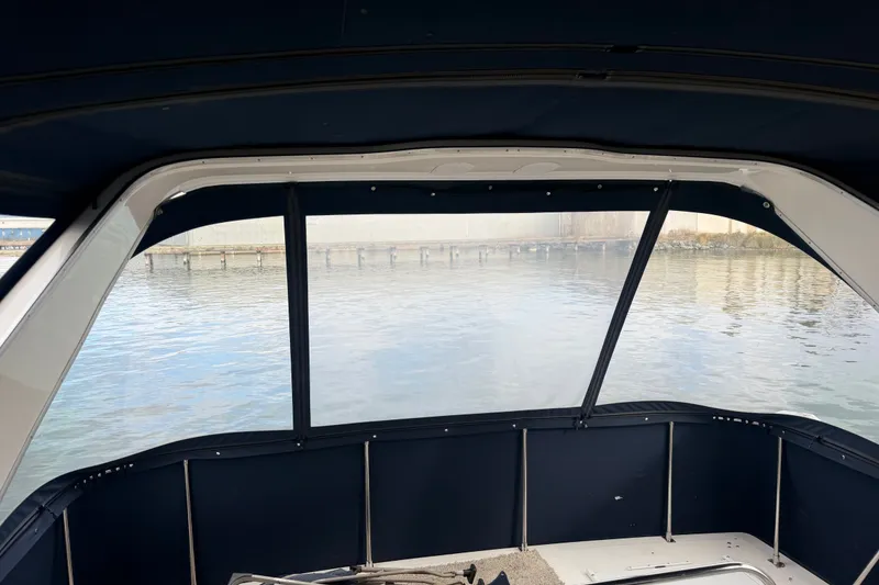 Slide: The Image of Bayliner 3988 Command Bridge Motoryacht 2000, interior view with water backdrop. - 42